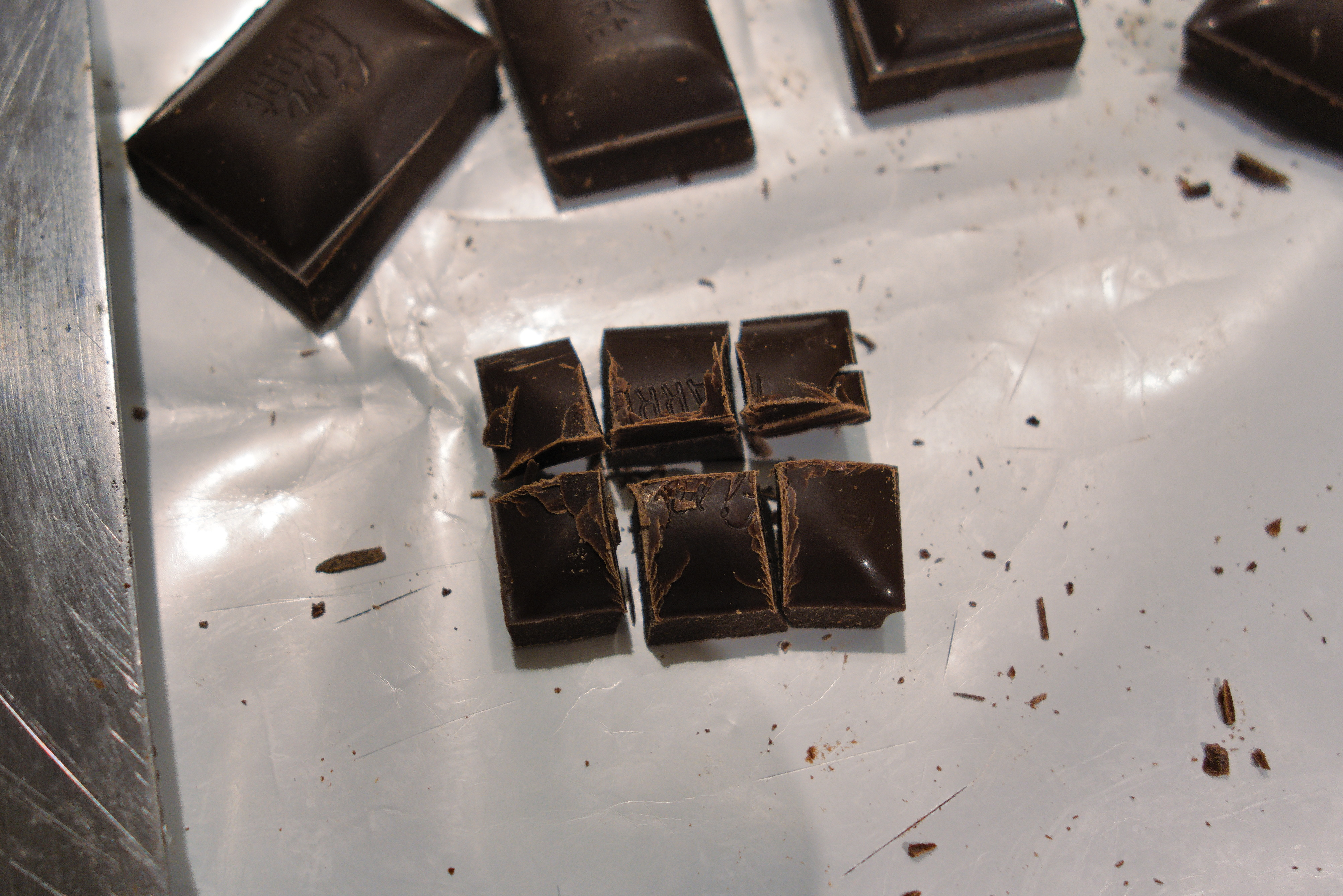Chopping a square of chocolate into 6