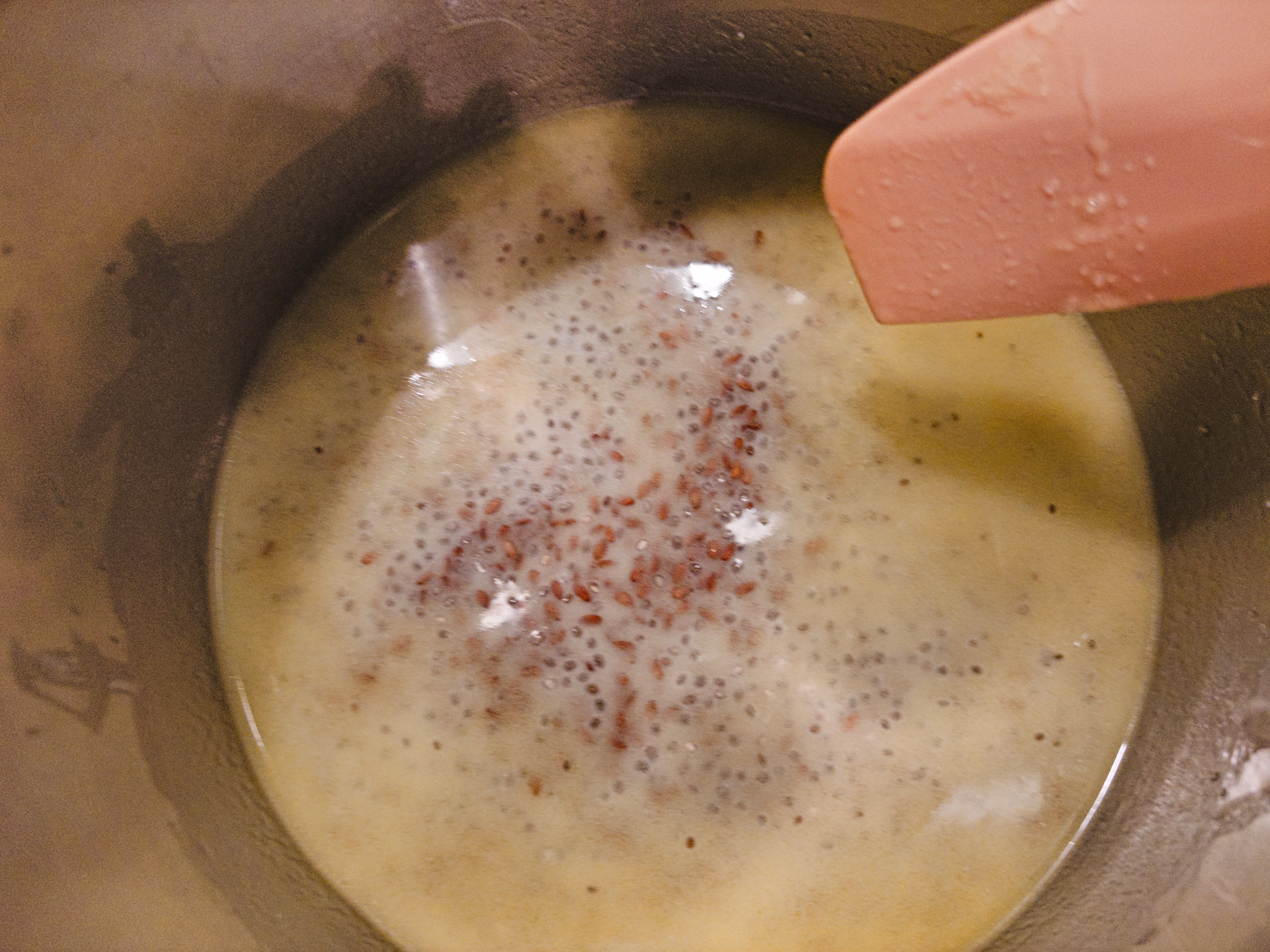 Butter, sugar, syrup, and flax pudding in a pot